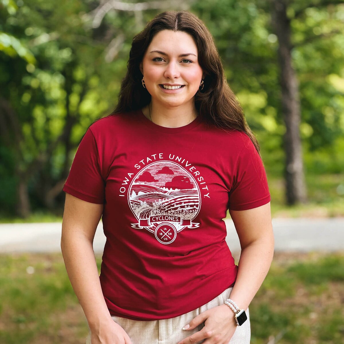 A student wearing Uscape I-State Cardinal Crest Lightweight Short Sleeve T-Shirt